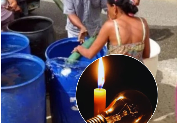 Moradores de un barrio de Santo Domingo Este protestan en las calles junto a neumáticos encendidos y tanques de agua vacíos en medio de la oscuridad nocturna