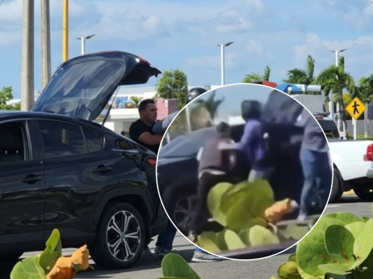 Captura de video aficionado que muestra el momento exacto en que un motociclista levanta un casco negro para golpear a una mujer junto a su vehículo en la Autopista Rafael Fernández Domínguez.